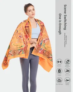 Detail of bohemian microfiber beach towel used as a large sun pattern printed shawl