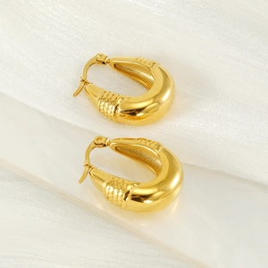 Elegant gold hollow teardrop hoop earrings with snake skin texture and a vintage geometric design