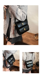 Detail of vintage oil-wax leather shoulder bag with metallic gold twist lock and front pocket