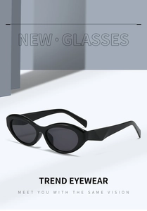 Side view of modern minimalist black oval cat-eye sunglasses with dark lenses