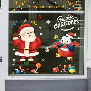 Merry Christmas window stickers featuring Santa Claus and penguins on glass background