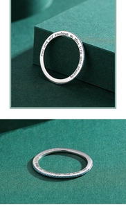 Detail view of silver ring with turquoise stones and soulful engraved message