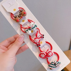 Set de 10 accessoires cheveux de Noël comprenant des breloques renne et bonhomme de neige