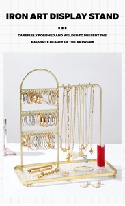 Macro shot of golden iron jewelry organizer with multi-layer hooks and necklace display rack
