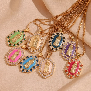 Detail of 18K gold-plated Virgin Mary pendants with colorful enamel and zircon crystals