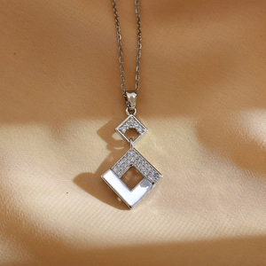 Luxurious silver necklace with interlocking geometric squares and sparkling cubic zirconia