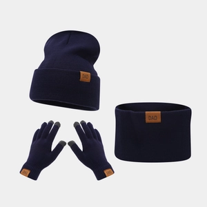 Detail of navy blue winter knit set with DAD leather patch and touch screen gloves