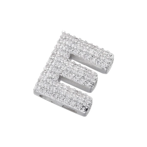 Macro shot of silver letter E pendant with brilliant micro-pave cubic zirconia stones