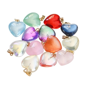 Detailed view of colorful acrylic heart pendants with gold clasps for DIY jewelry making