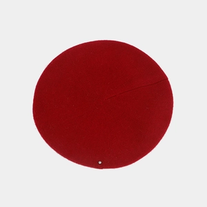 Top view of a red wool blend beret featuring a single sparkling rhinestone detail