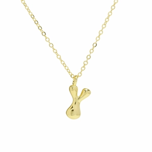 Detailed view of bubble-style gold letter Y pendant with highly polished fluid surface