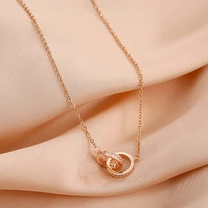 Elegant rose gold double interlocking ring necklace with pavé cubic zirconia on silk