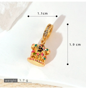 Detailed macro view of a carousel pendant with colorful enamel and cubic zirconia