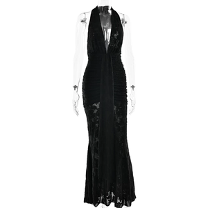 Detailed view of black slim-fit dress featuring deep V-neck and lace mermaid hemline
