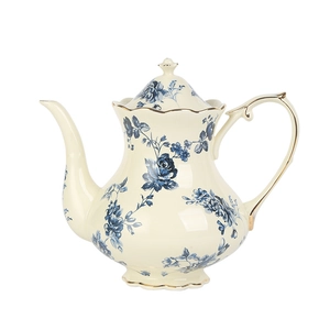 Théière vintage en céramique française avec motif floral bleu et élégants bords dorés