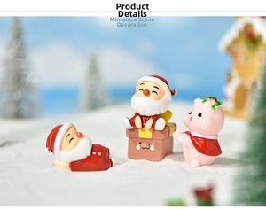 Miniature resin Santa Claus and pink pig figurines in a snowy Christmas micro landscape