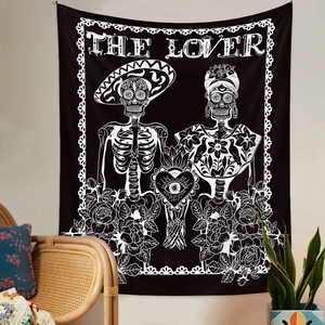 Detail of The Lover tapestry featuring skull couple and roses on wall background