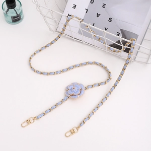 Close-up of baby blue leather chain strap with pearl camellia flower and lobster clasps