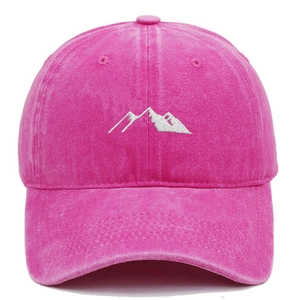 Detail of fuchsia washed cotton baseball cap with white mountain embroidery texture