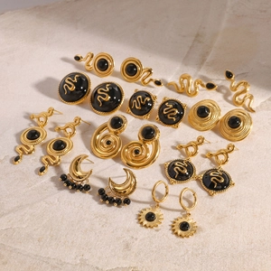 Detailed collection of vintage gold stainless steel earrings with black onyx accents