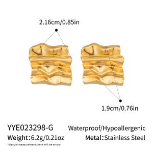Detail view of 18K gold plated irregular wave earrings showing 2.16cm size and weight