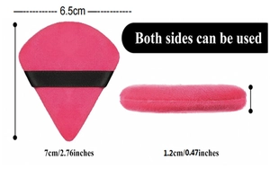 Macro view of bright pink velvet makeup puff with dimensions and black ribbon strap