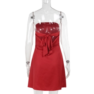 Back view of a red satin mini dress featuring a large elegant bow tie detail