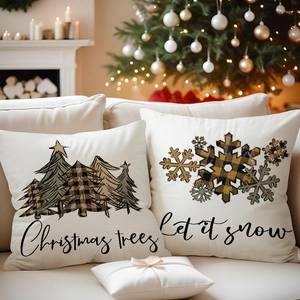 Linen Christmas tree pillow covers with snowflake prints on white fabric on a cozy sofa