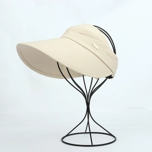 Beige wide brim sun visor hat for women with knit texture and metal accent for outdoor use