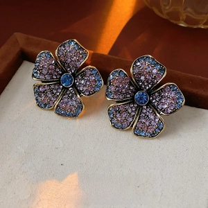 Vintage bronze flower earrings with purple and blue crystals in luxury retro style