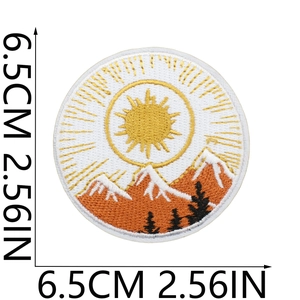 Measurement photo showing 6.5cm diameter for sun and mountain embroidery patch