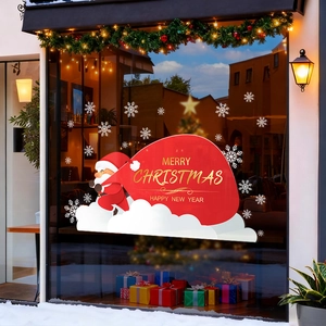Christmas Santa Claus static window cling on shop glass with snowflakes and festive lights