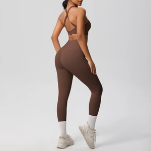 Brown high-waisted yoga leggings side pocket and cross back sports bra detail