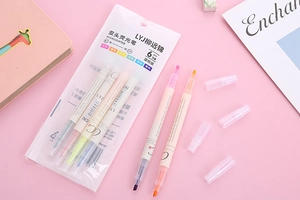 Flat lay of 6 dual-tip pastel highlighters with broad and fine nibs for stationery