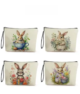 Detailed pattern display of canvas Easter makeup bags with rabbit and floral watercolor art