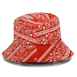 Detailed close-up of a red and white bandana paisley print bucket hat in cotton fabric
