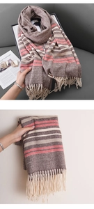 Detailed view of striped knit scarf in brown and pink with tassels and herringbone texture