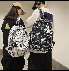 Detail of street-style graffiti backpacks in black and white with Love letter patterns