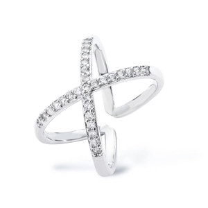 Detailed macro view of X-shaped ring with polished silver finish and sparkling zircons