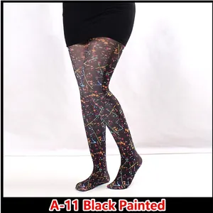 Close-up of black sheer tights with colorful abstract paint splatter print design