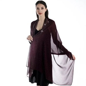 Detailed view of wine red chiffon shawl with elegant rhinestone star patterns