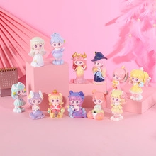 Collection of twelve cute cartoon figures on pink pedestals for home decoration display