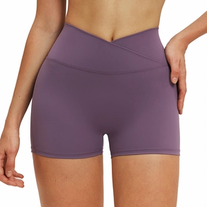 Women's high waisted crossover yoga shorts in deep purple stretchy brushed fabric