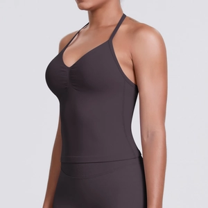 Detail of ruched V-neck yoga top with thin straps in dark brown seamless elastic fabric