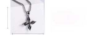 Detail shot of vintage stainless steel cross pendant showing dimensions 50mm by 40mm