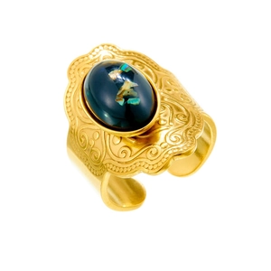 Vintage gold-plated stainless steel ring with oval green stone and bohemian carvings