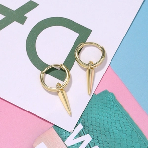 Classic gold copper earrings featuring small hoops and sleek tapered cone pendants