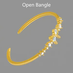 Golden open-ended bangle bracelet with pear-shaped cubic zirconia butterfly branch design