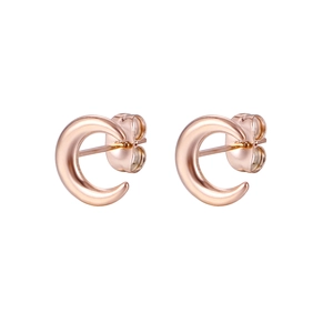 Close-up of polished rose gold C-shaped stud earrings in a minimalist modern design