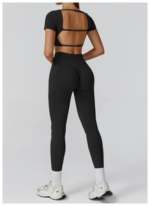 Rear view of black seamless yoga set featuring hollow back buckle and high waist leggings